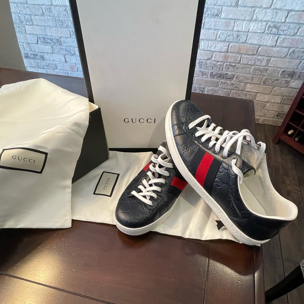 Gucci mens Blue embossed leather sneakers.